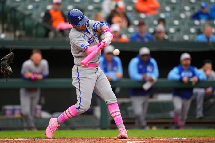 May 8, 2022; Baltimore, Maryland, USA; Kansas City Royals second baseman Whit Merrifield (15) hits a sacrifice fly ball to score a run against the Baltimore Orioles during the second inning at Oriole Park at Camden Yards. Mandatory Credit: Gregory Fisher-USA TODAY Sports